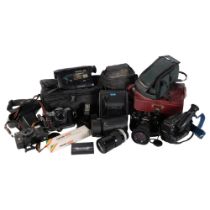 A quantity of Vintage cameras and handheld video recorders, with associated accessories, including a