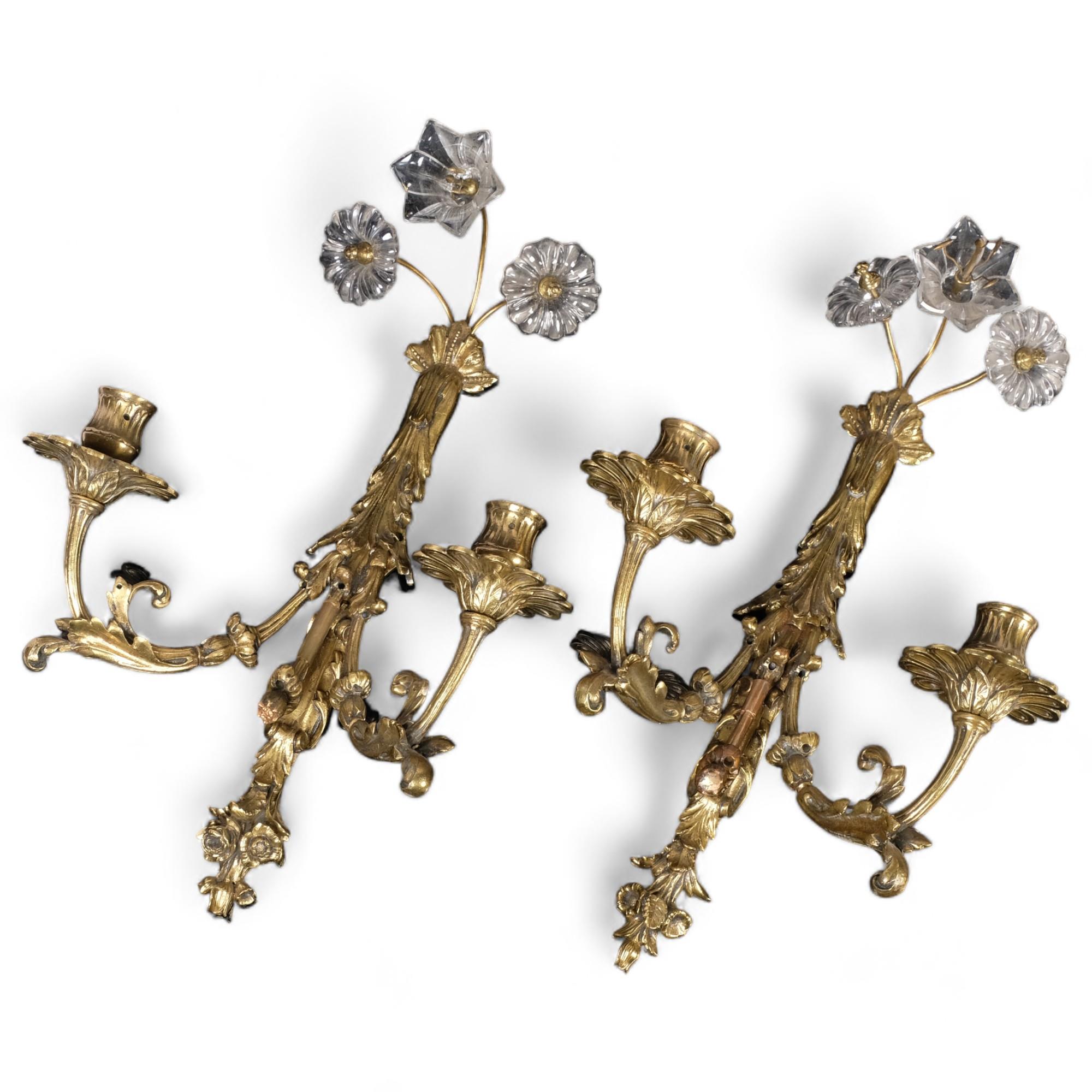 A pair of ornate cast-brass twin wall lights, with glass floral decoration, H45cm