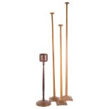 A graduated set of vintage oak hat stands, largest 152cm, and another (4).