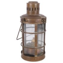 A copper-framed lantern with burner and swing handle, H35cm