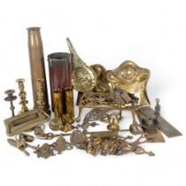 A 1943 brass shell case, 43cm, 2 smaller ones, brass door knocker, crumb trays, candlesticks etc