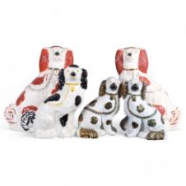 A pair of large Beswick Staffordshire Spaniels, auburn markings, both marked to the underside,