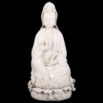 A Chinese porcelain figure of Guanyin sitting on a lotus leaf, H27cm Good overall condition, a few