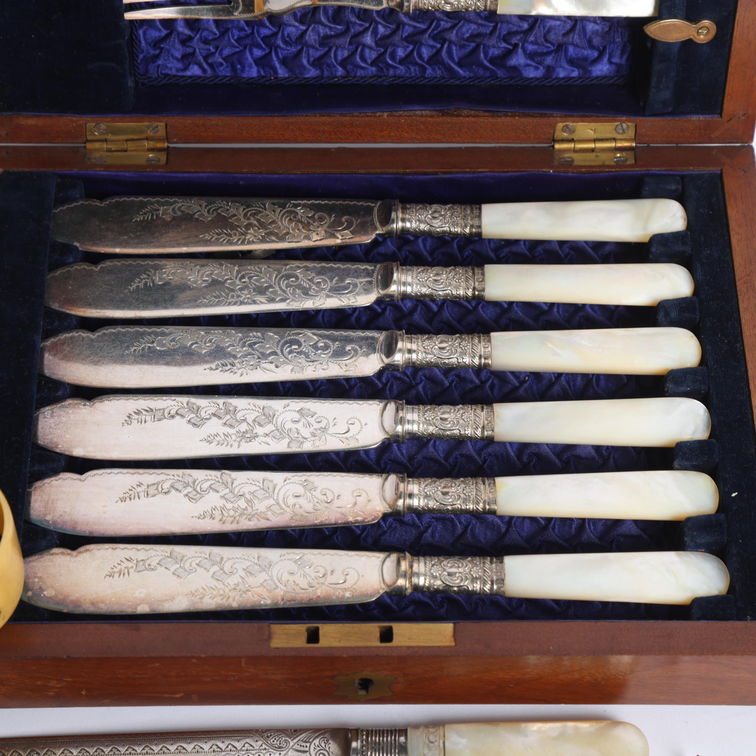 A cased fish cutlery set for 6 people, with mother-of-pearl handles and engraved blades, with silver - Image 2 of 2