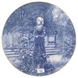 An Antique Continental charger, with figural printed decoration, diameter 40cm There is a small