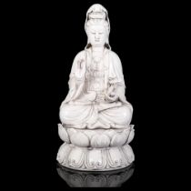 A large Chinese blanc de chine figure of Guanyin seated on a lotus bed, H37cm Good overall