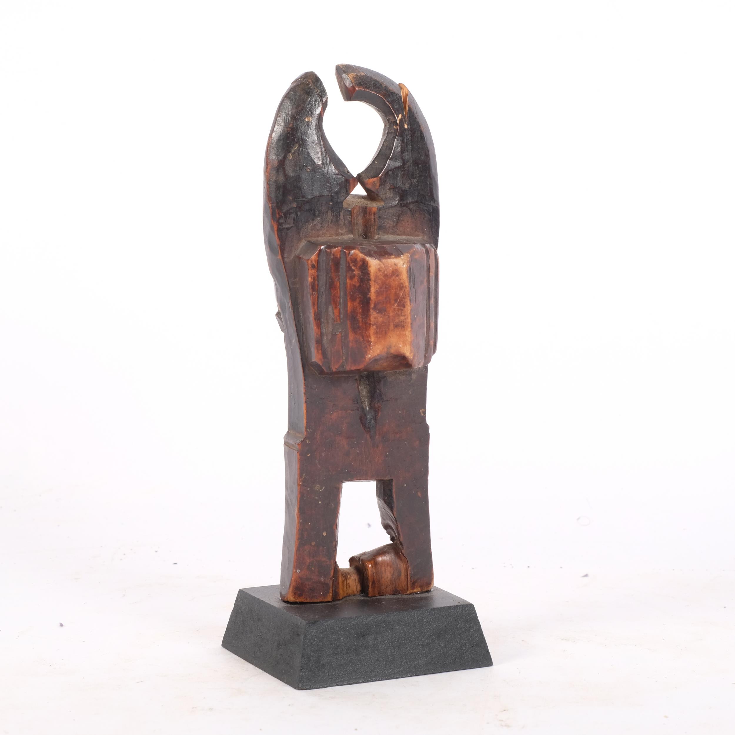 A Baule, Ivory Coast weaving pulley, carved wood masked figure on wooden plinth, height 16cm Break - Image 2 of 2
