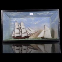 A 19th century ship diorama, depicting a 2-masted sailing ship and single-masted boat in