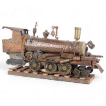 Clive Fredriksson 2024, a copper and brass steampunk locomotive on wooden track, L66cm