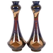 Carl Luber, a pair of large Art Nouveau polychrome decorated pottery vases, by Johann Von Schwarz,
