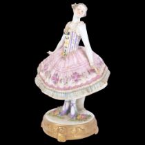 A Continental porcelain figure group, a ballet dancer, H24cm
