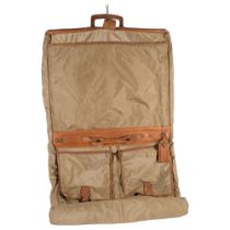 HARTMANN - a Vintage Hartmann brown leather trim and nylon suitcase/wardrobe bag, 106cm including