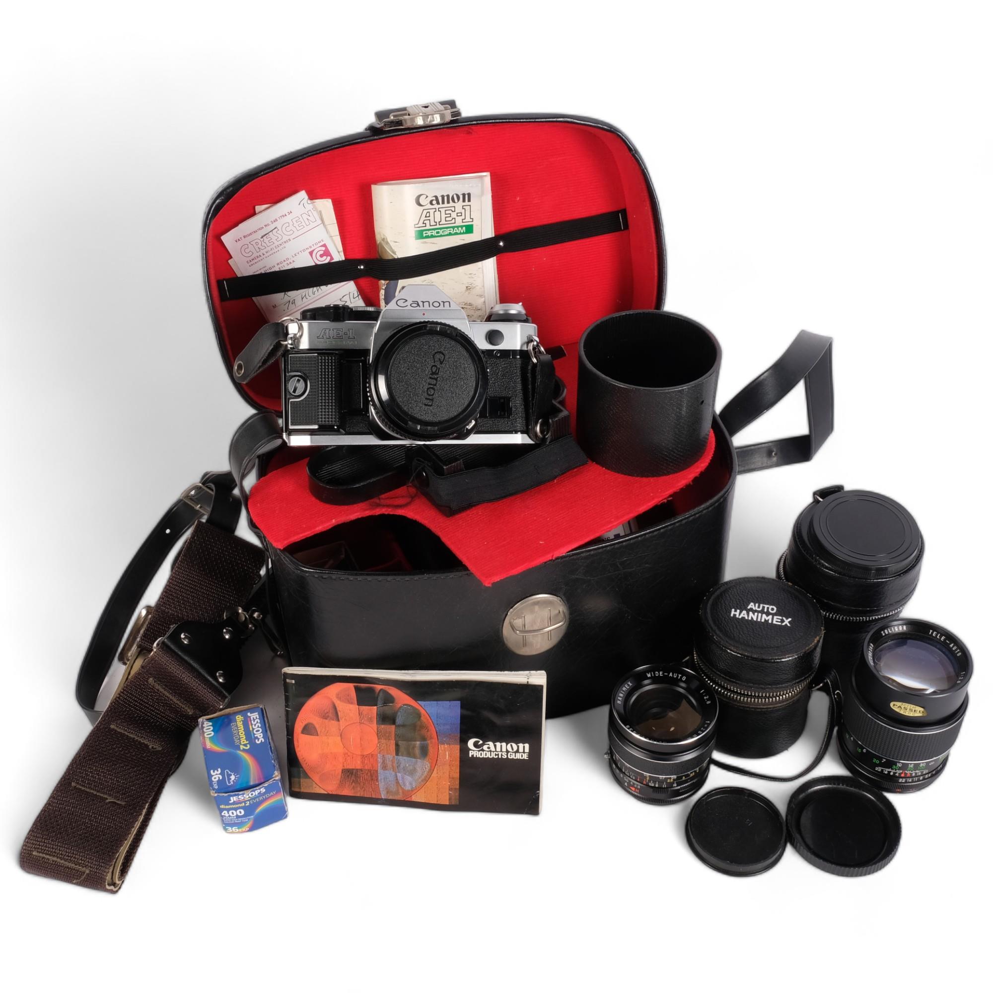 A Canon AE-1 Programme 35mm SLR camera, with associated Canon 50mm lens, additional lenses,