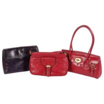 A group of 3 modern lady's handbags, including 2 red Carriage handbags, associated dust covers,