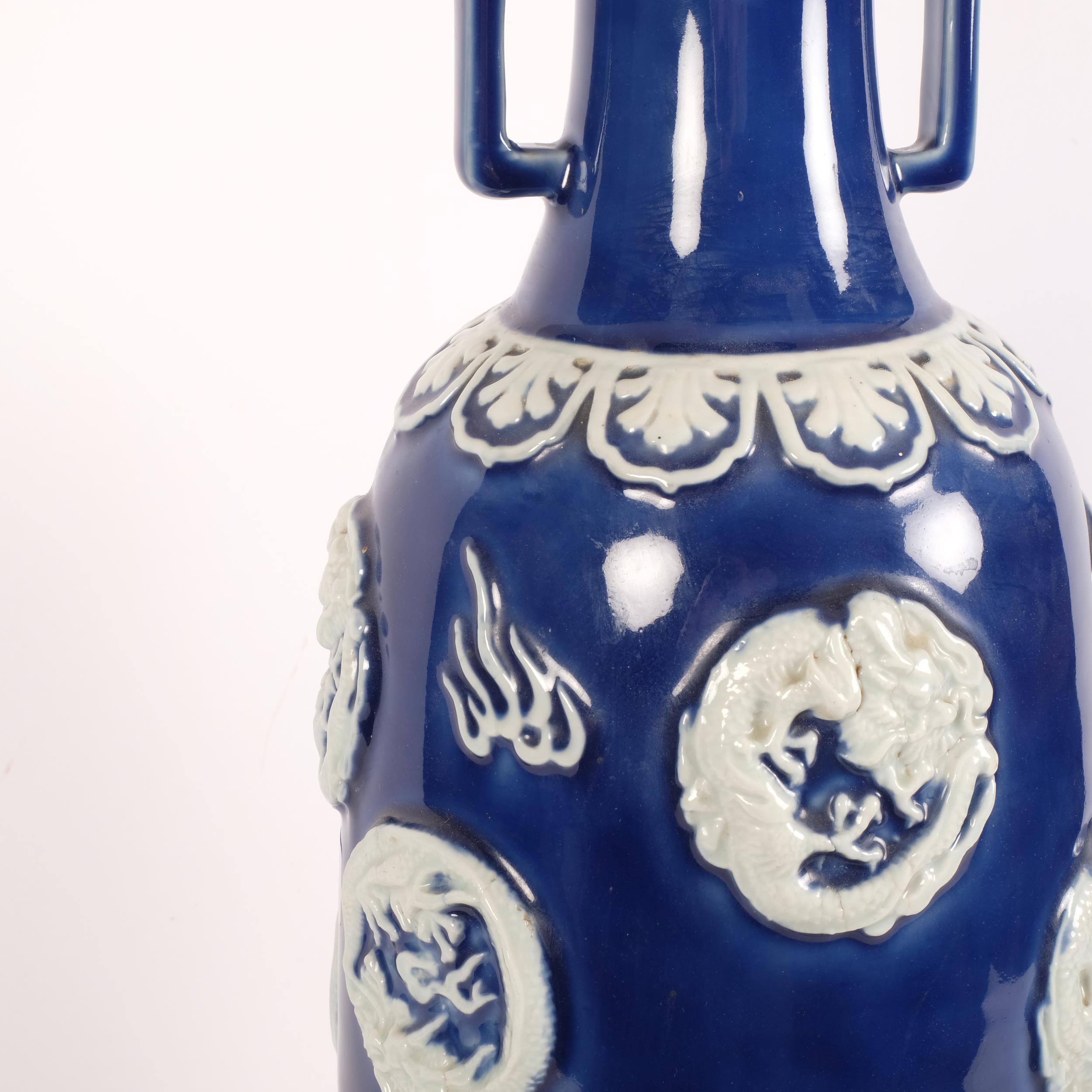 An Oriental ceramic blue and white table lamp, with embossed decoration and shade, H82cm - Image 2 of 2
