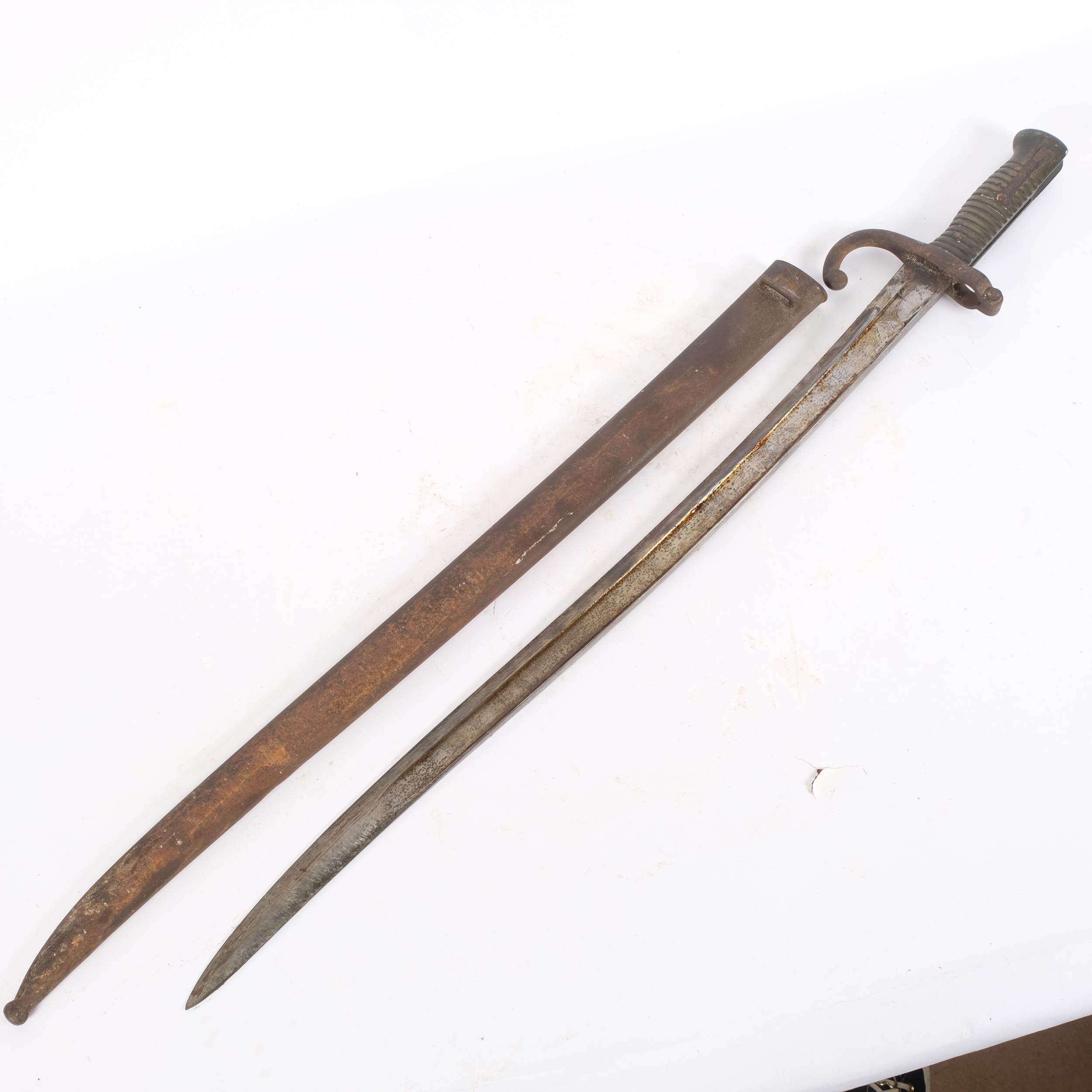 A French 1866 pattern Chassepot bayonet and scabbard, with script along the top edge, blade length - Image 2 of 2