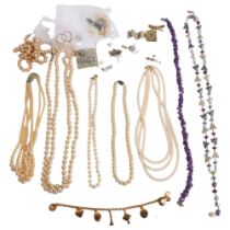 A box of various costume jewellery, including an amethyst necklace, a Brooks & Bentley bracelet, a