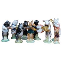 A group of 9 Beswick pig figure musicians, including Matthew The Bugle Player, H15cm