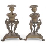 A pair of ornate Antique brass candlesticks of Classical design, H19.5cm