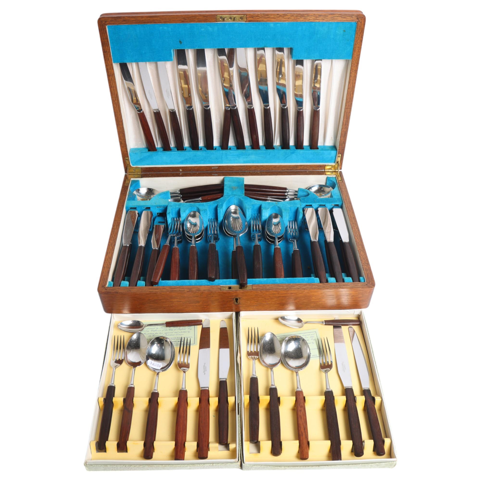 THOMAS W CORK & SON - a canteen of stainless steel cutlery with stained hardwood handles, cased