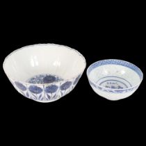 A Chinese porcelain blue and white bowl with chrysanthemum decoration (A/F), and a similar smaller