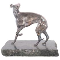 A silvered metal study of a Greyhound, on polished stone plinth, H15cm overall
