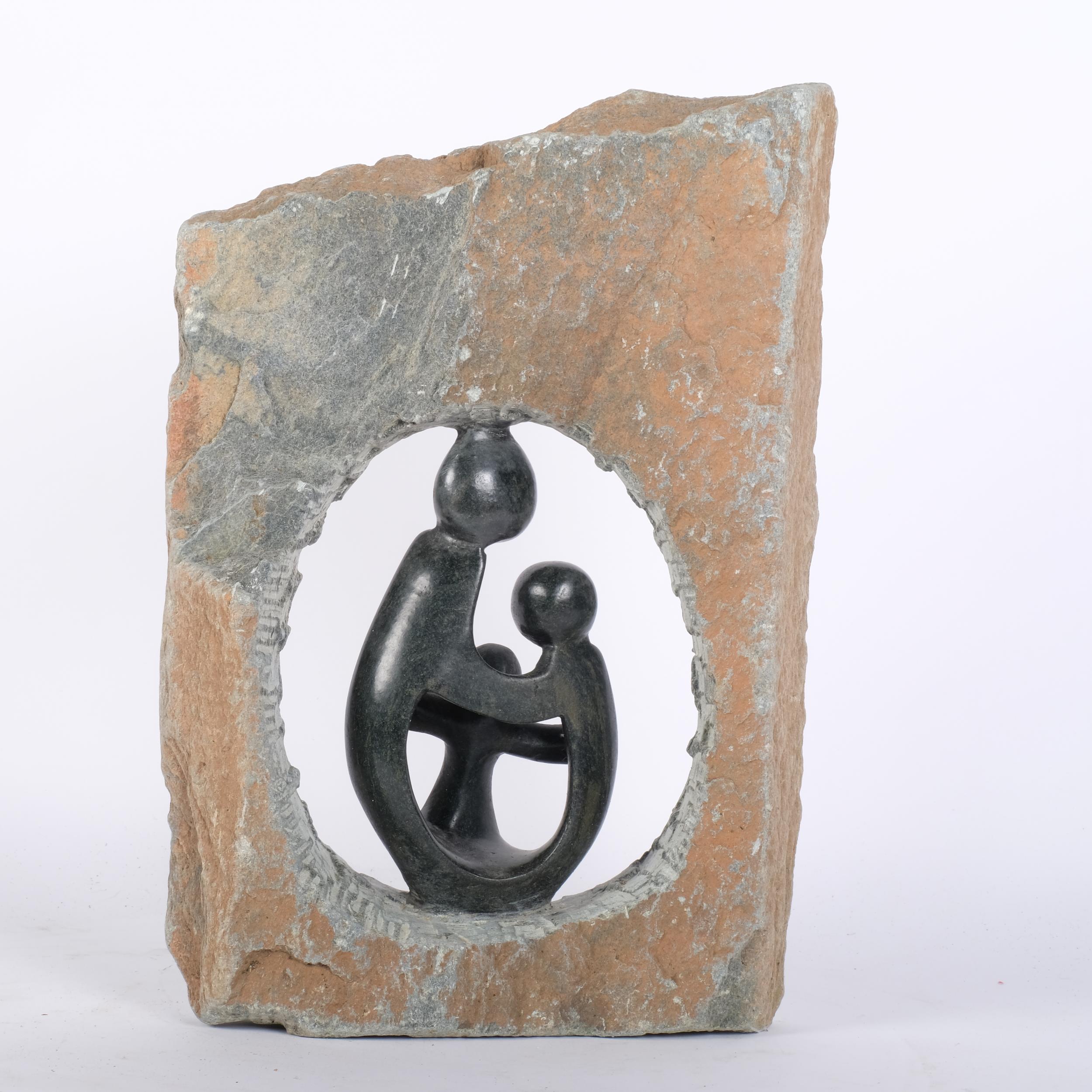 A carved stone sculpture depicting a framed mother and her children, H38cm - Image 2 of 2