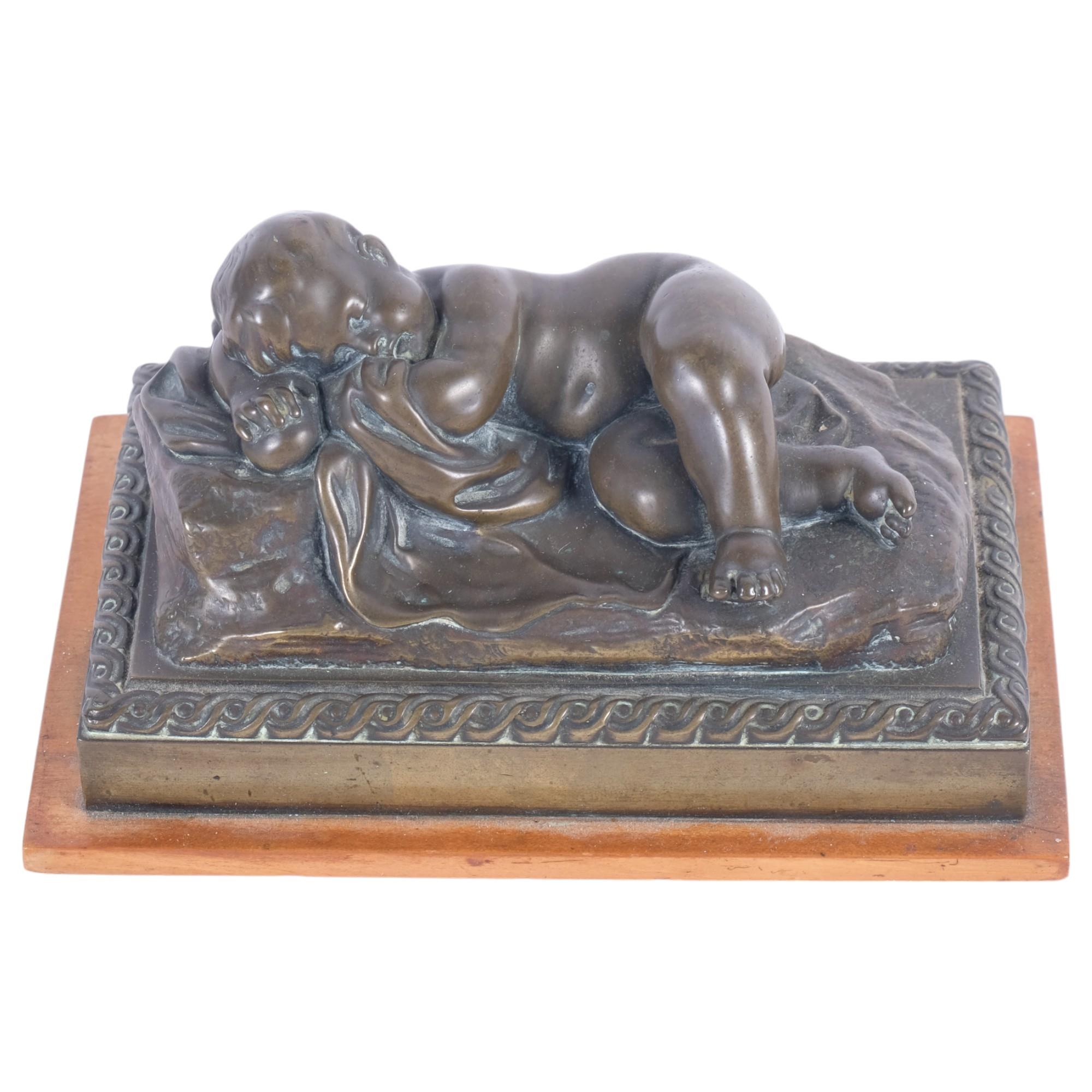 A patinated cast-bronze study of a sleeping child, overall length 15.5cm