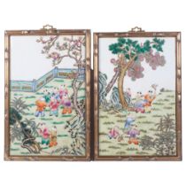 A pair of Chinese porcelain and enamel decorated plaques, panel size 27cm x 42cm, 31cm x 46cm
