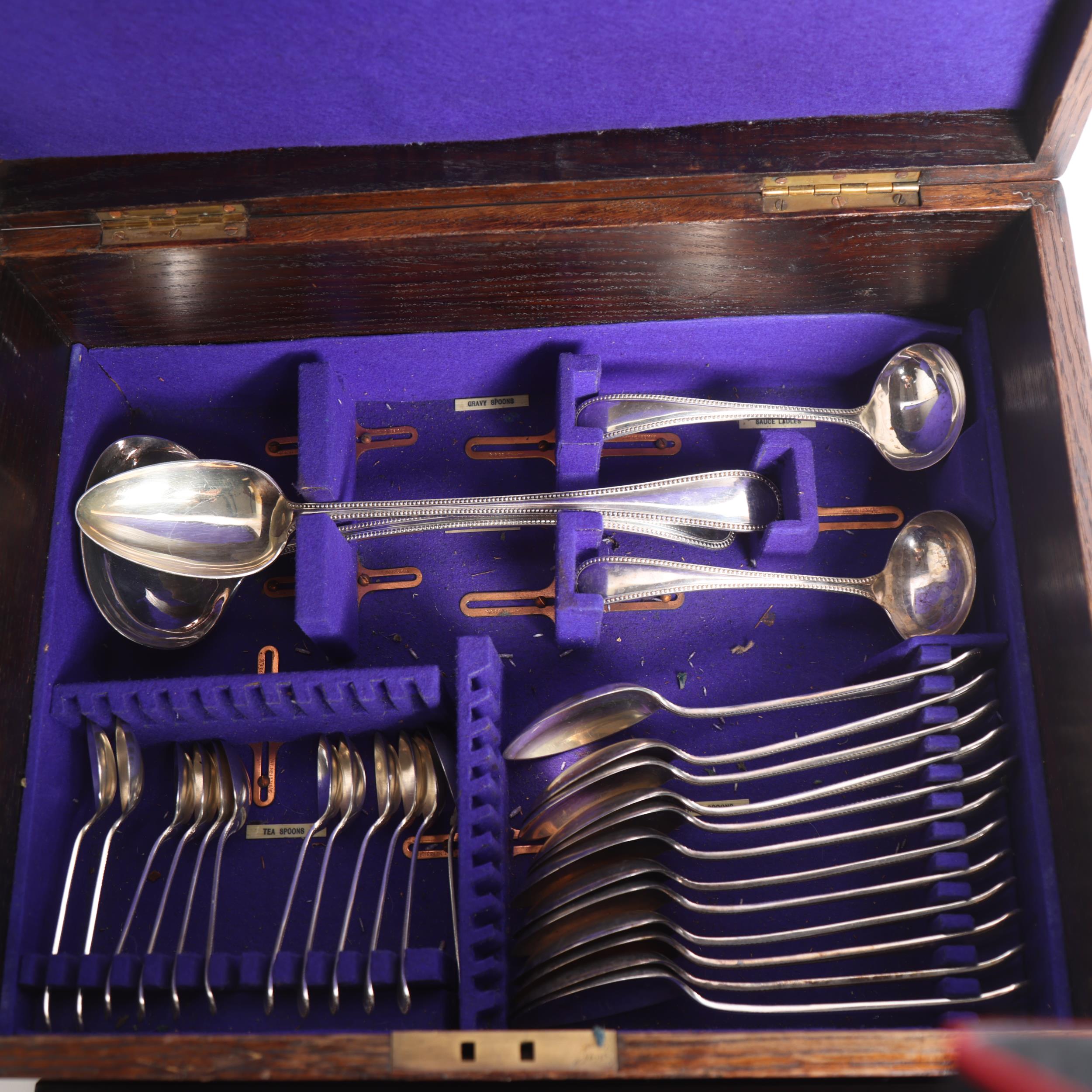 HENRY HOBSON & SONS - a part canteen of bead-edge plated cutlery, in an oak fitted canteen box - Image 2 of 2