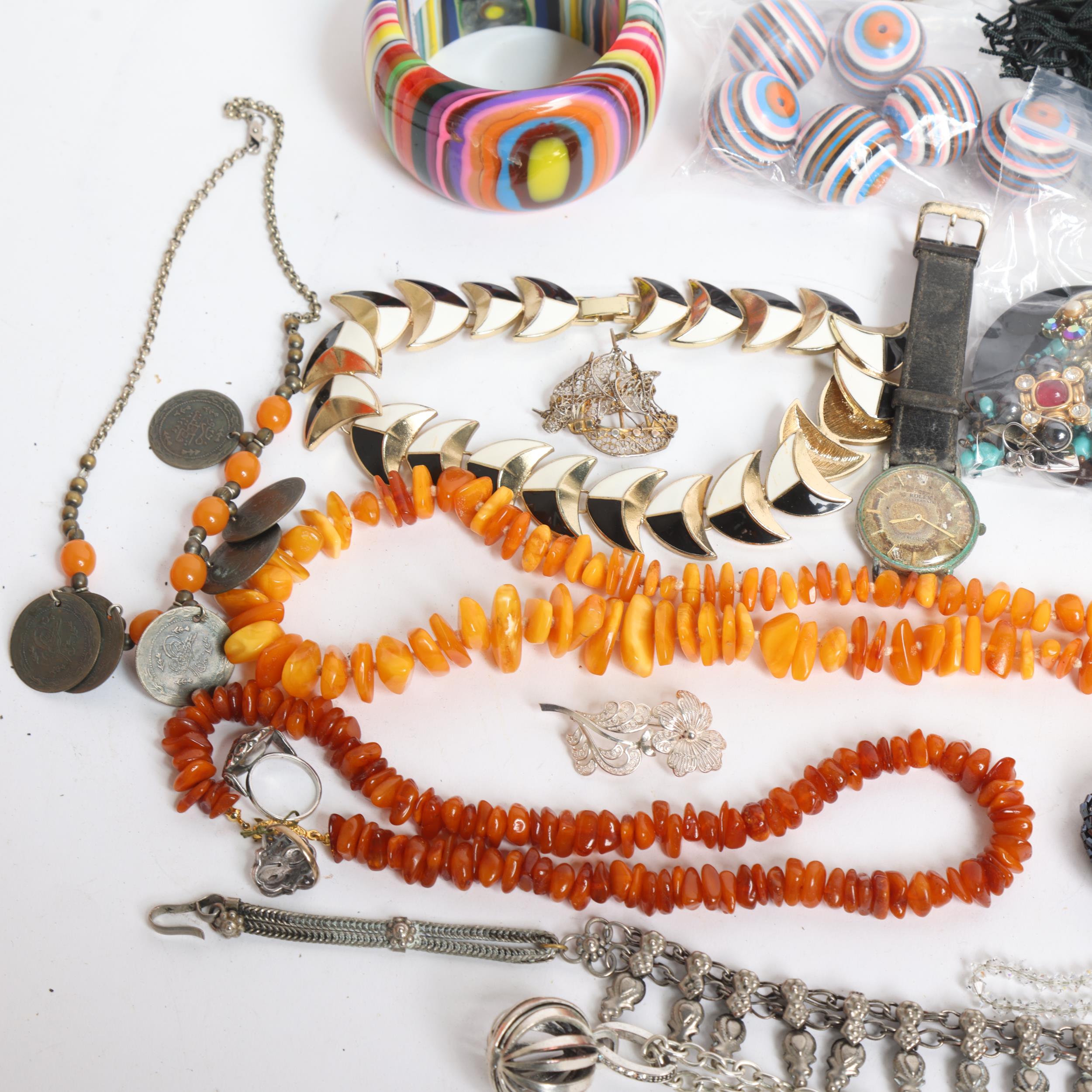 A tray of various costume jewellery, including an amber pebble panel bracelet, various necklaces, - Image 2 of 2