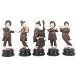 Unusual set of carved wood and bone musicians, on wooden plinths, cellist height 17cm
