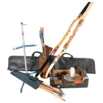 A quantity of archery equipment, including bows, arrows, stands and other accessories, various