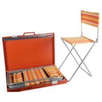 An Italian "style" mid-century picnic set in case, comprising striped seats with tubular steel