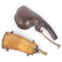 An Antique buffalo horn powder flask with brass mounts, and a pressed stitch leather shot flask