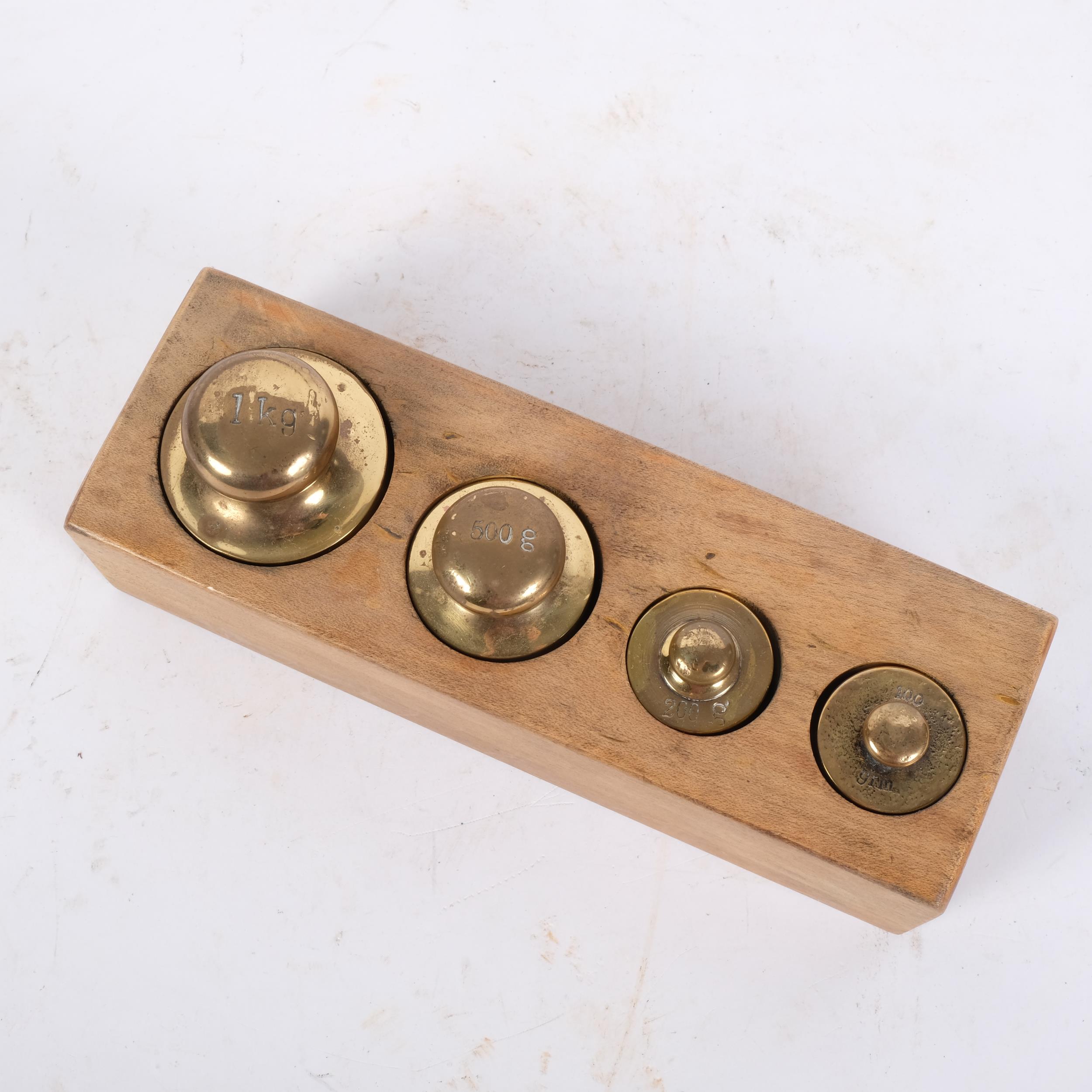 A graduated set of Continental bronze apothecary weights, in fitted stand - Image 2 of 2