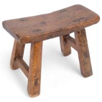 A small 19th century elm stool, 26.5cm x 19cm