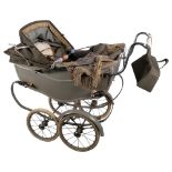 A Vintage Silver Cross pram, of typical form on sprung base, grey in colour, mark to handle, L95cm