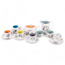 A Susie Cooper bone china tea set for 5 people, with fruit decoration, including teapot and 2 jugs