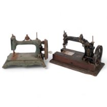 An 1878 Wheeler & Wilson hand crank sewing machine, and another early cast-iron sewing machine for