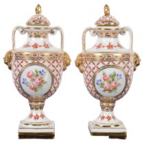 A pair of Antique Sevres porcelain urns and covers, H16.5cm, with impressed mark to the underside