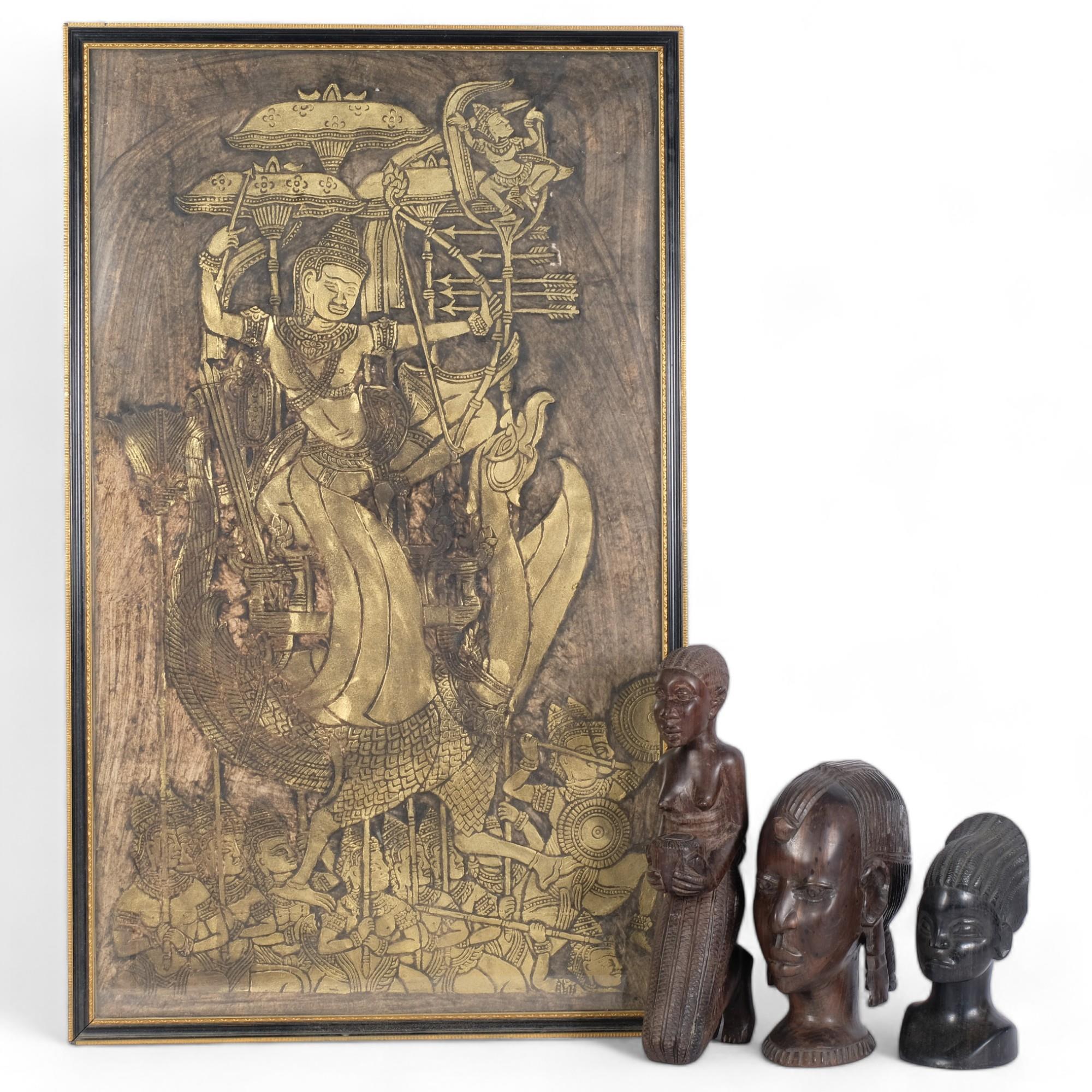 An embossed painted and gilded study of an Eastern dancer, framed, 80cm x 50cm overall, and 3 Tribal