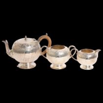 A silver plated 3-piece tea set of engraved and fluted form