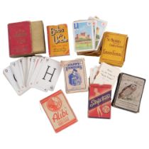A collection of Antique packs of playing cards, including Bob's Your Uncle, Animal Grab, and