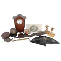A box of interesting items, including an unusual mahogany and brass-cased clock on ball feet, 25.
