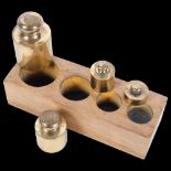 A graduated set of Continental bronze apothecary weights, in fitted stand