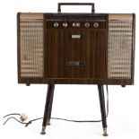 A Vintage mi-20th century Crown V stereo 12-transistor stereo radio phonograph record player,