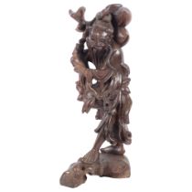 A large Oriental carved wood figure of a man, 50cm