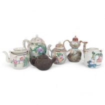 A group of Oriental teapots, including a famille rose, a terracotta teapot, etc (6) Teapot has a