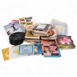 A quantity of vinyl 7" records, various artists and genres, including Paul McCartney, Elvis Presley,